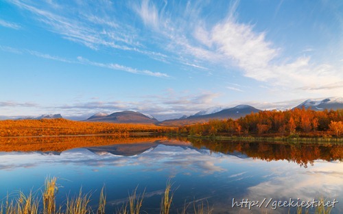 Clouds and Autumn Colors Reflected in Lake, Abisko National Park, Sweden