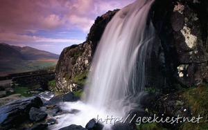 Waterfall and jagged rocks in Conor Pass, County Kerry, Ireland
